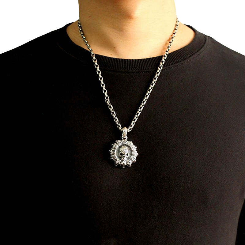 Unisex gothic stainless steel skull pendant worn on a black t-shirt, perfect for alternative fashion enthusiasts.