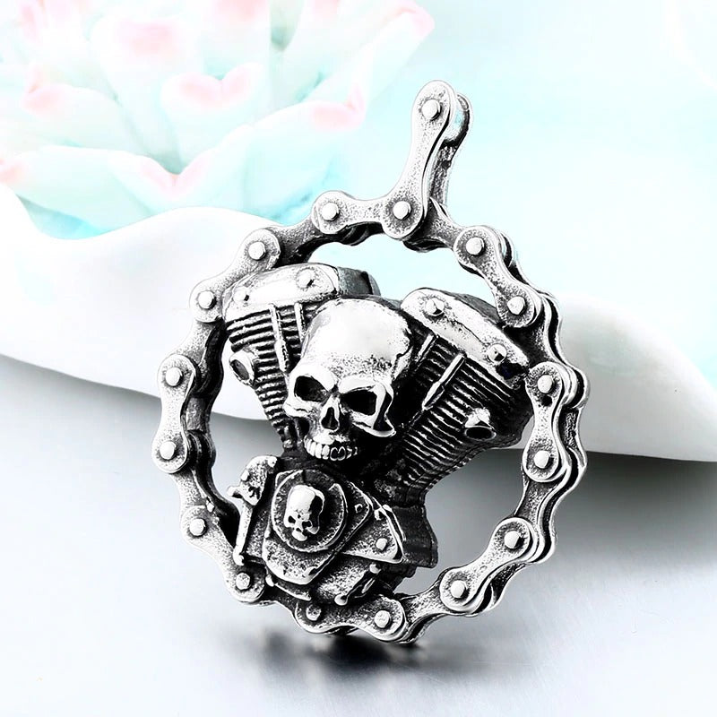 Steel skull motorcycle engine pendant necklace with chain design for bikers, perfect for rides and parties.