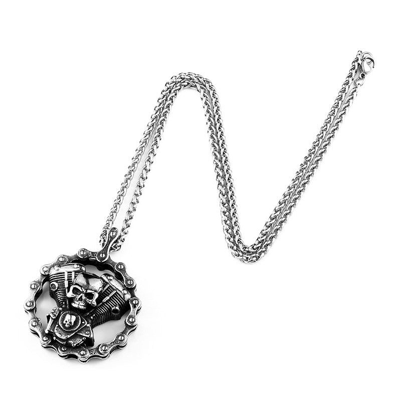 Steel skull motorcycle engine pendant necklace on chain, perfect biker jewelry for parties and rides.