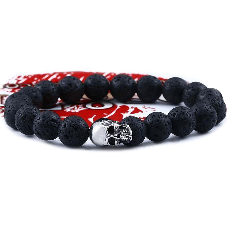 Trendy skull lava stone bracelet made of black beads, perfect for unisex alternative fashion and rock events.