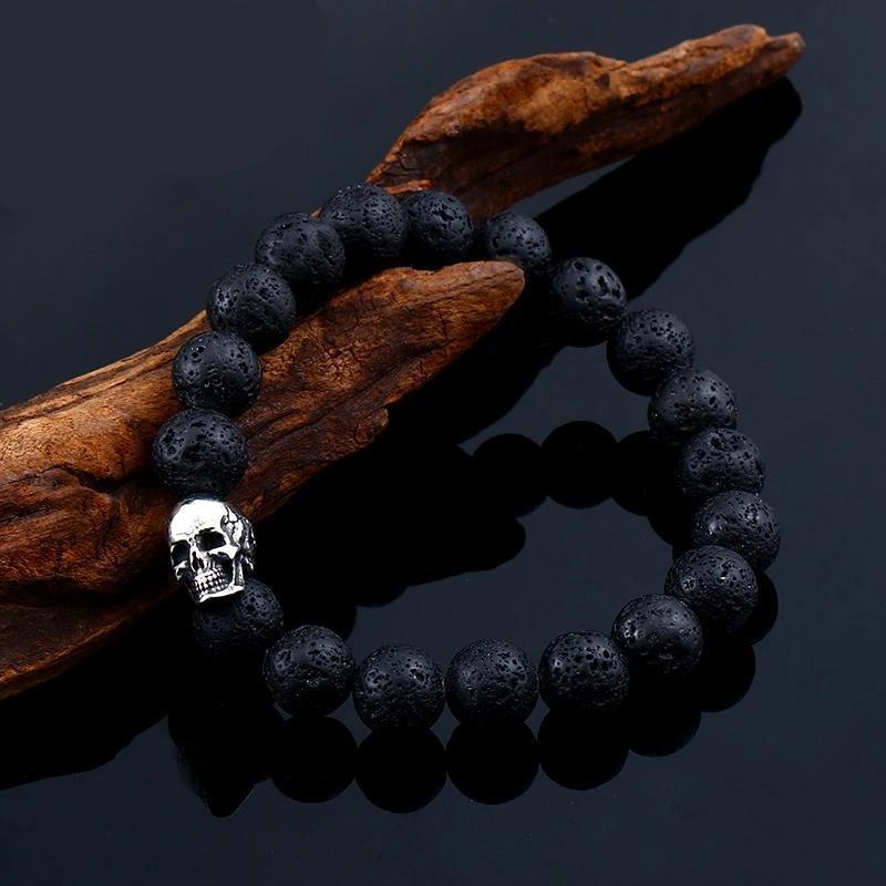 Skull Lava Stone Bracelet on wood background, trendy unisex accessory, perfect for rock events and casual outings.