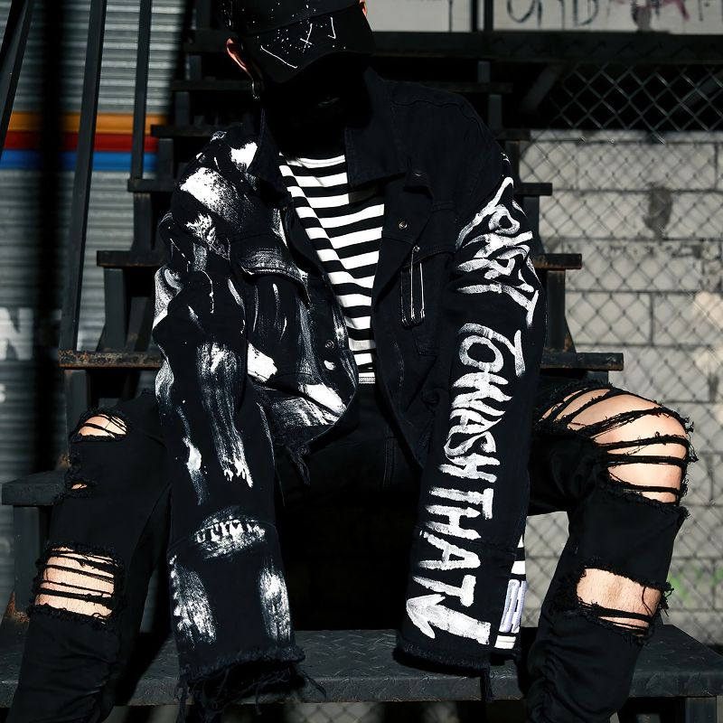 Streetwear men's graffiti print jeans jacket with ripped details, stylish black design for urban rock fashion.