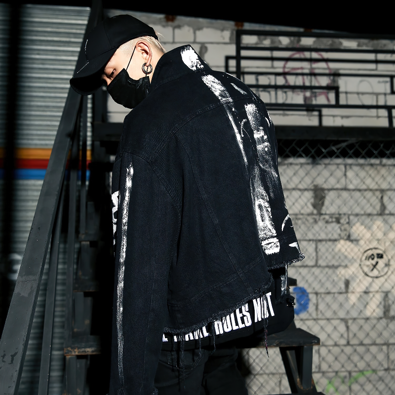 Stylish men graffiti print jeans jacket in urban setting, perfect for streetwear outfits.