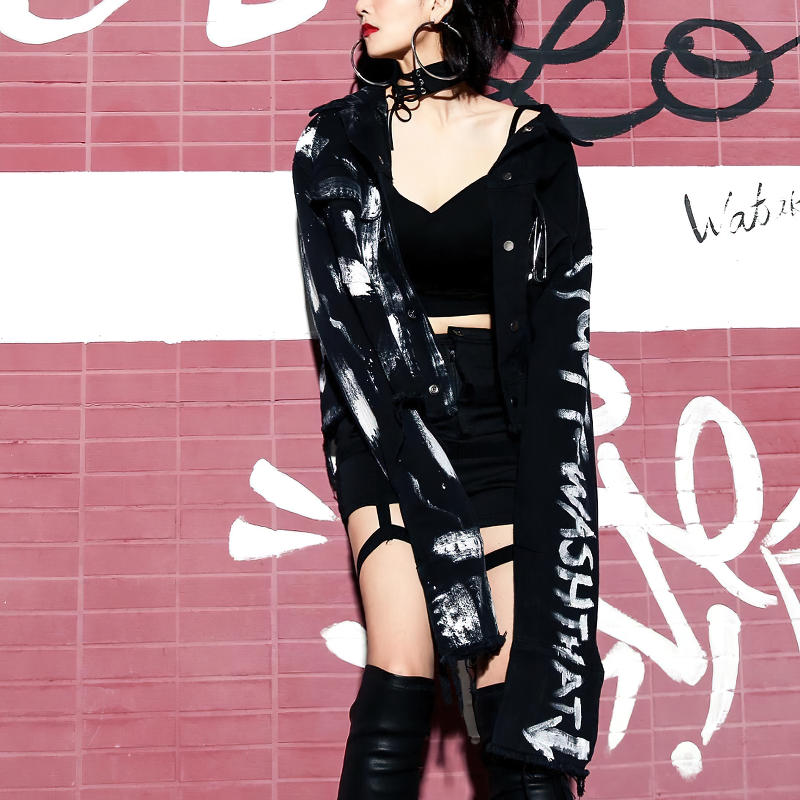 Streetwear women graffiti print jeans jacket styled with crop top and skirt, perfect for modern urban fashion.