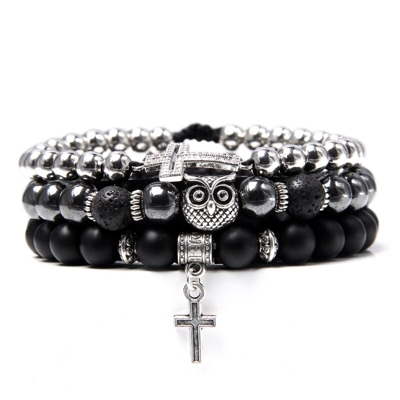 Handmade multiple charm bracelet featuring natural stone beads, owl charm, and cross detail for a stylish look.