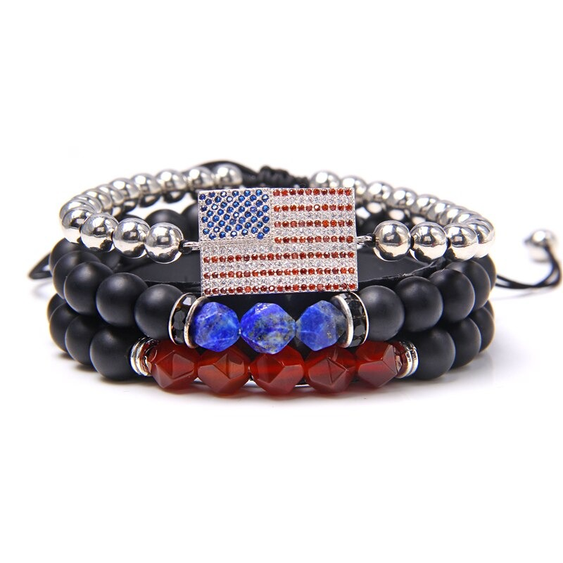 Handmade unisex charm bracelet featuring natural stone beads and a vintage flag pendant in a layered design.