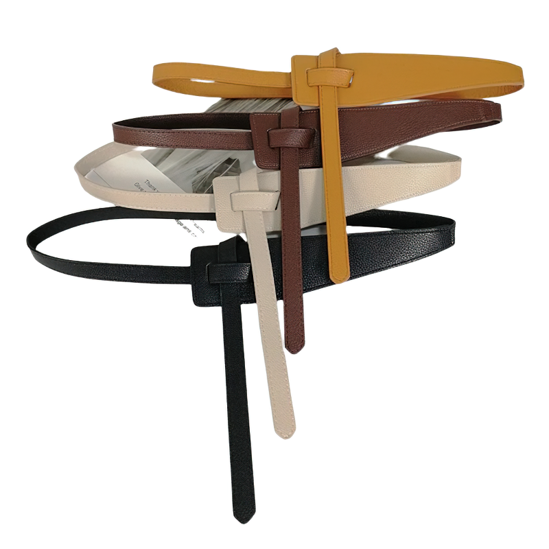 Stylish women's belts made of soft PU leather in various colors stacked creatively for casual outfit inspiration.