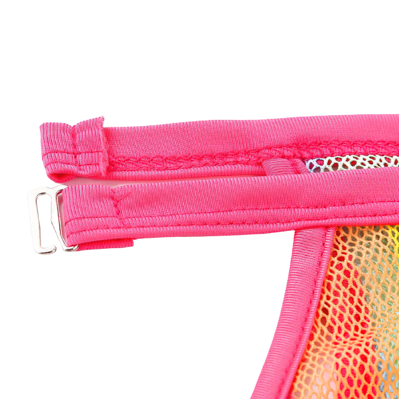 Close-up of the pink zipper and strap detail on a stylish women's bodysuit, showcasing vibrant fishnet design.