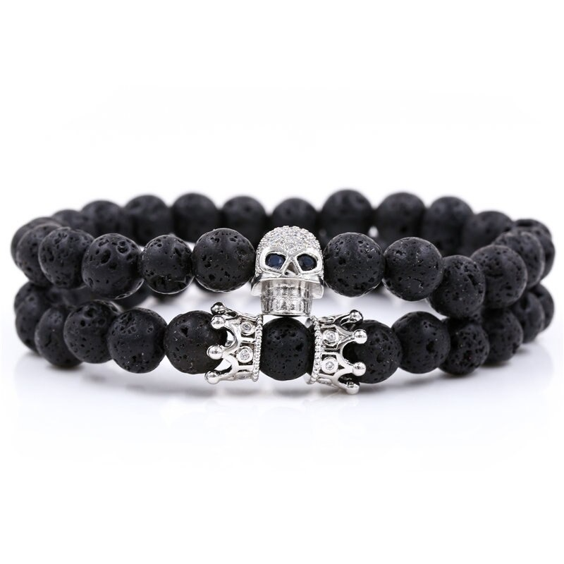 Unisex stylish bracelet featuring black beads, skull head, and crown accents for alternative fashion.