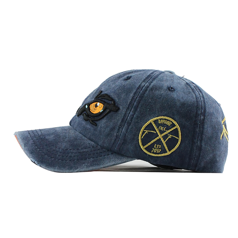 Stylish unisex cotton baseball cap with eagle eye embroidery, casual accessory for men and women in navy blue.