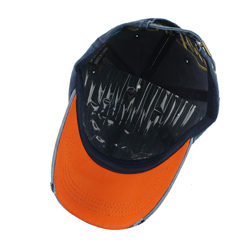 Inside view of a stylish unisex cotton baseball cap with eagle eye print, featuring an orange brim and comfortable design.
