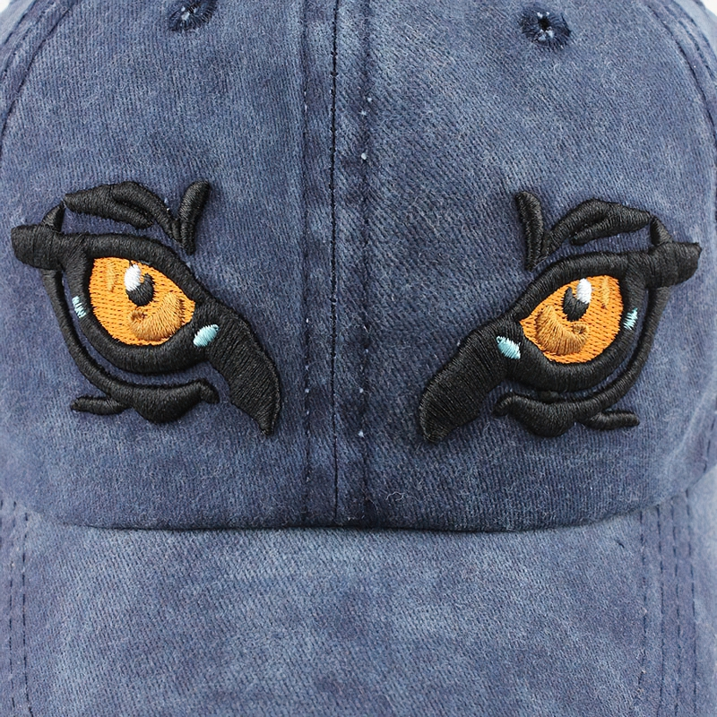 Stylish unisex cotton baseball cap featuring striking eagle eye embroidery in vibrant colors.