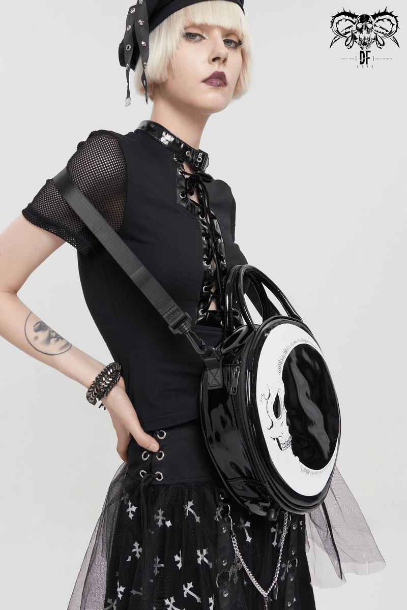 Gothic style women's crescent moon handbag featuring a skull design, perfect accessory for a chic, edgy look.