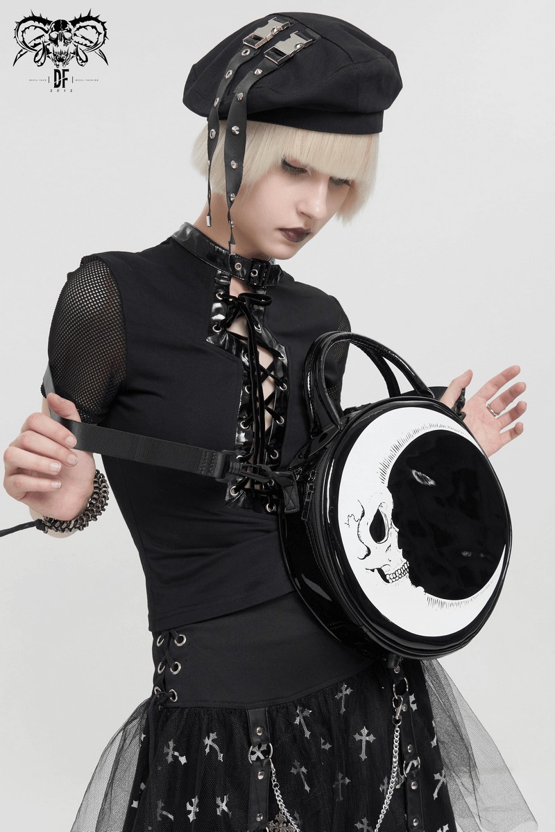 Gothic stylish woman showcasing a crescent moon skull handbag, perfect accessory for edgy fashion.
