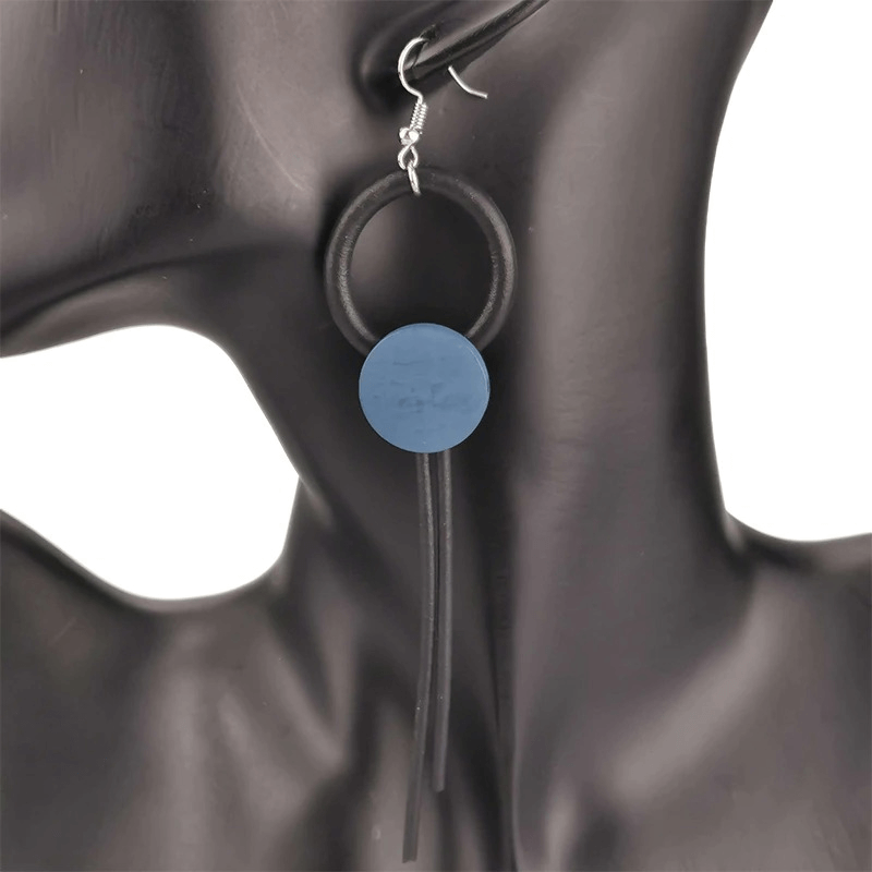 Stylish wood design long earrings in gothic style for women, featuring a blue circular pendant.