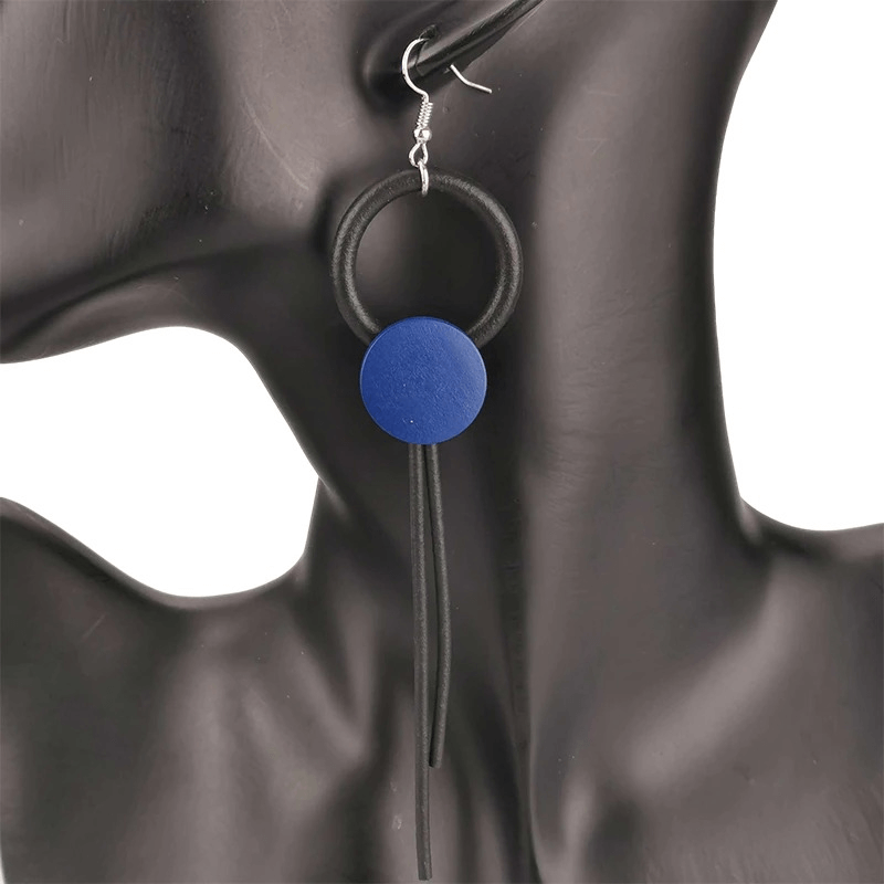 Stylish blue wood long earrings on a model, perfect gothic accessory for women.