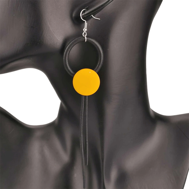 Stylish women’s wood design long earrings with a vibrant yellow circle, perfect gothic accessory for any outfit.