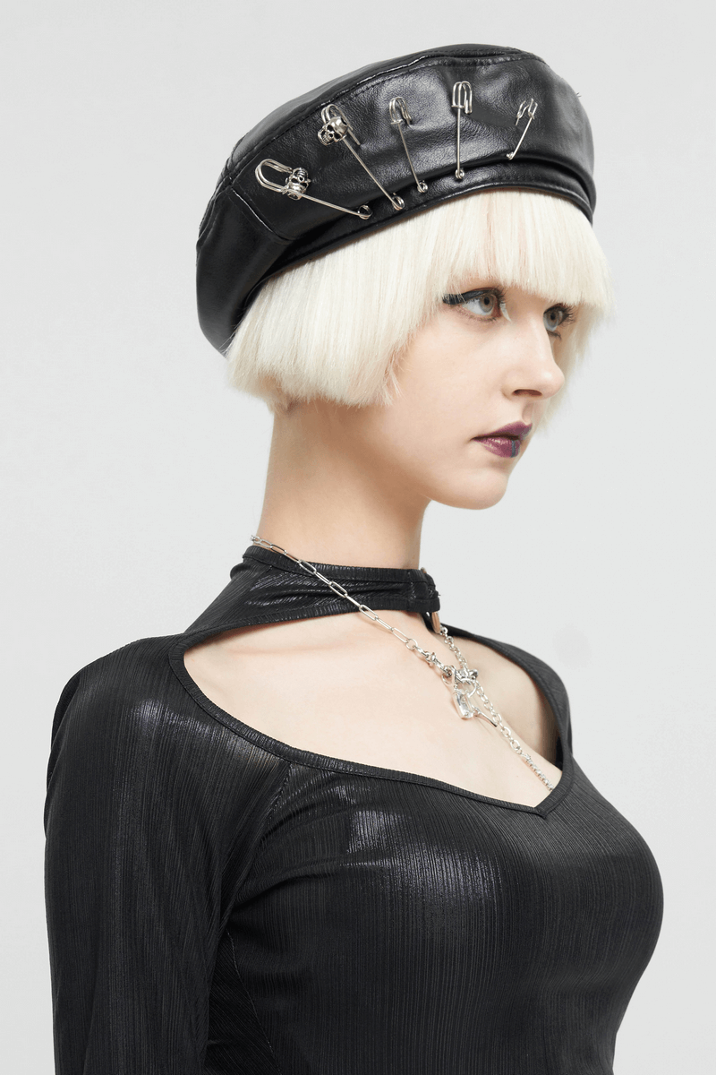 Stylish women's faux leather beret with pins, showcasing a punk aesthetic, perfect for edgy fashion lovers.