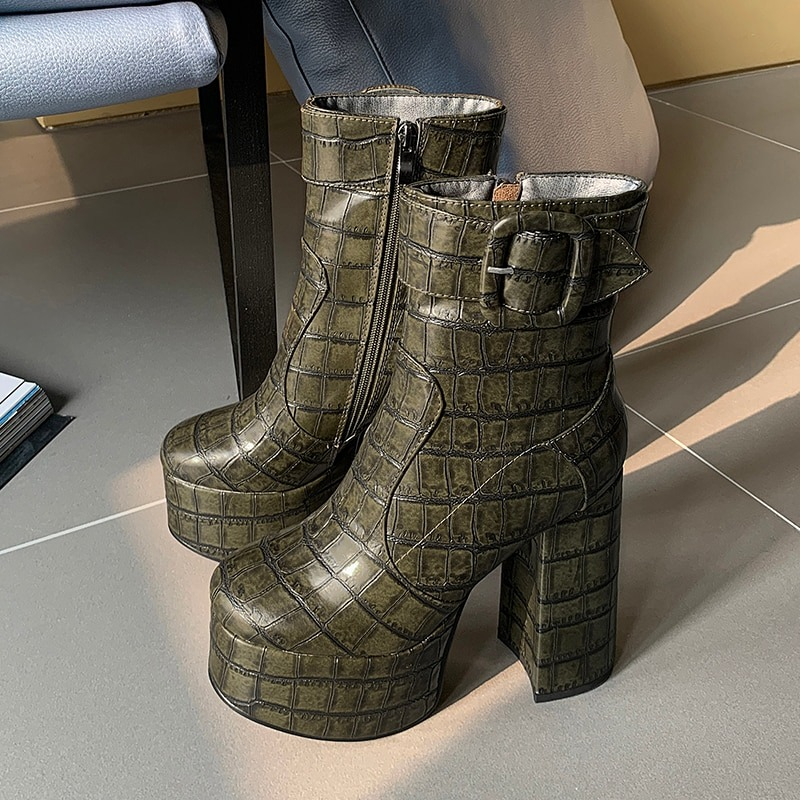 Stylish green crocodile print platform boots with buckle detail, perfect for casual chic looks.
