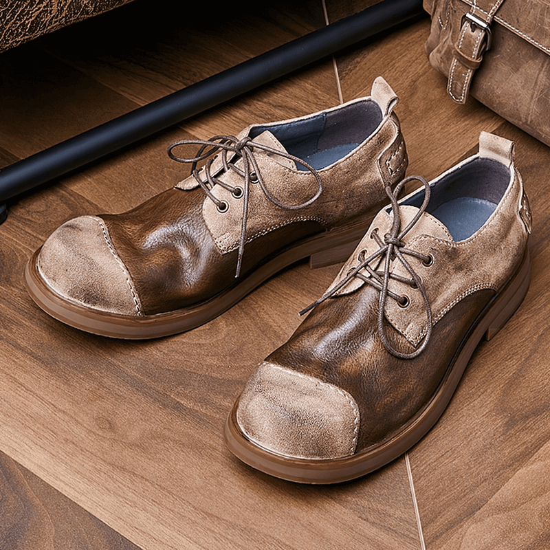 Stylish lace-up cowhide cowboy shoes in brown and tan for men, perfect for casual outfits and comfortable wear.