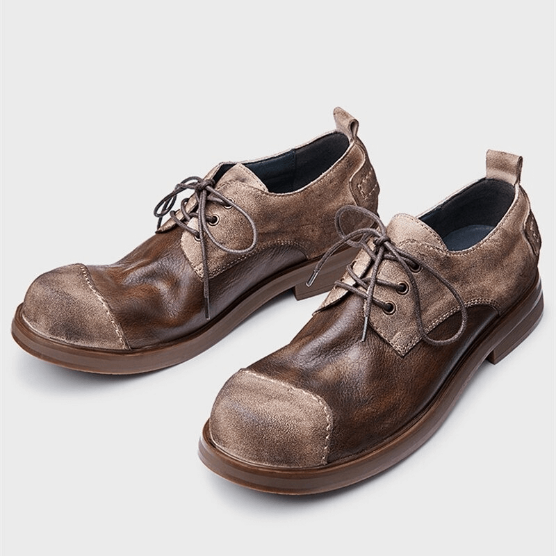 Stylish brown lace-up cowhide cowboy shoes for men, perfect for casual outfits with a round toe design.