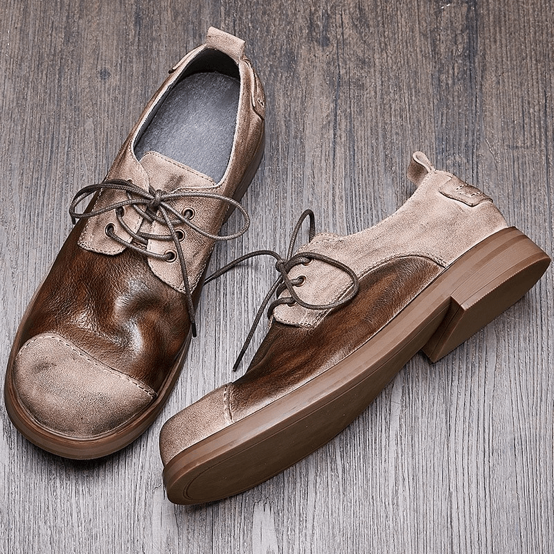 Stylish lace-up cowhide cowboy shoes for men, featuring a casual round toe design and quality materials.
