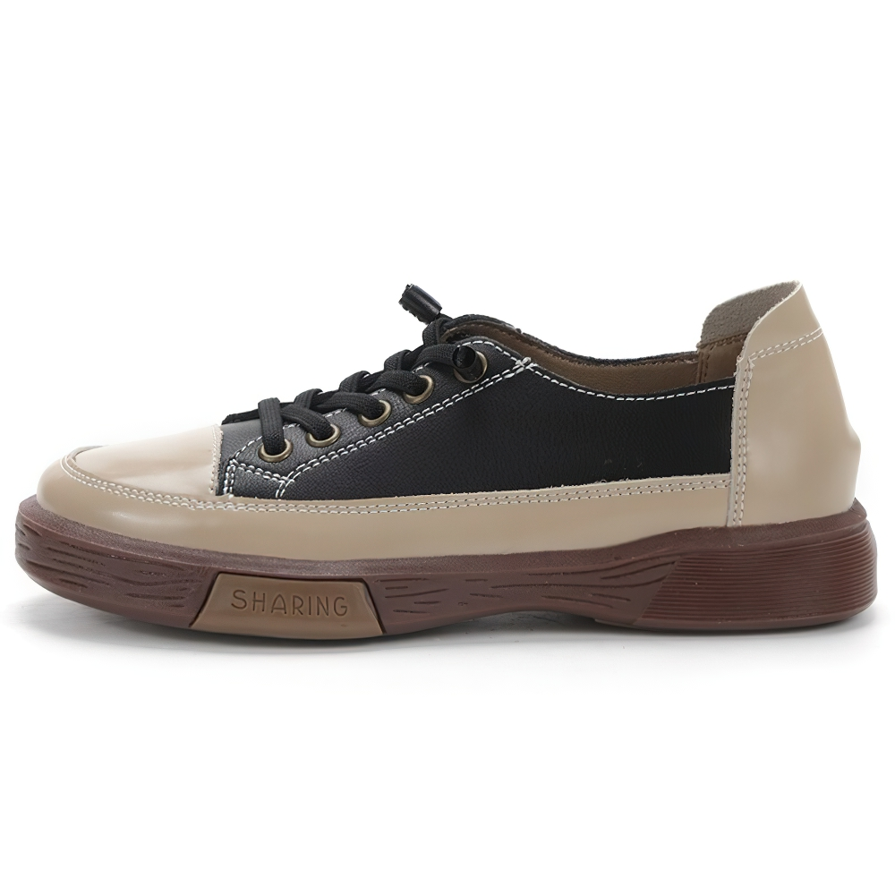 Stylish ladies genuine leather sneakers in beige and black, perfect for casual fashion and all-day comfort.