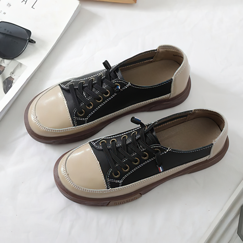 Stylish ladies genuine leather sneakers in black and beige, perfect for casual fashion and comfort.