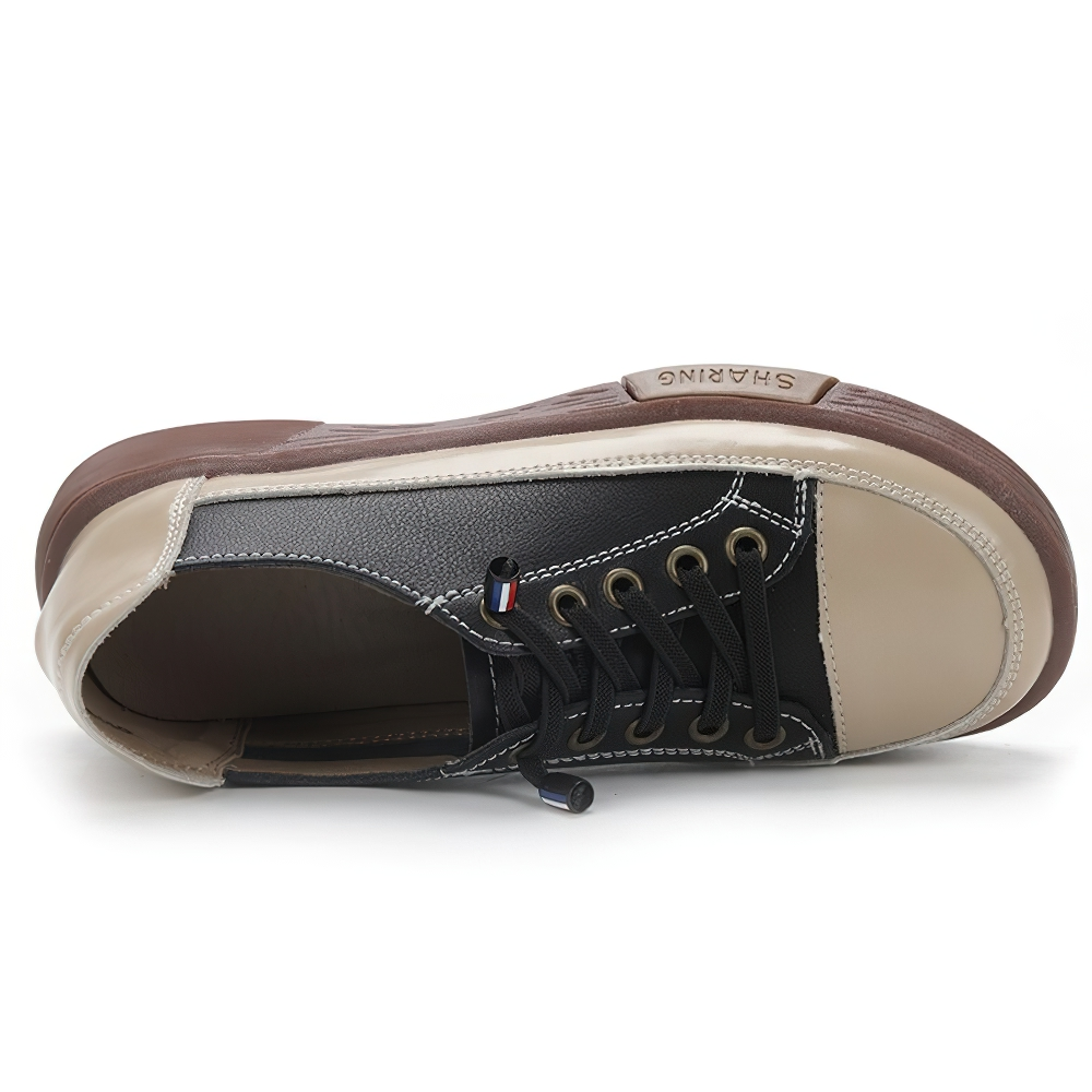 Stylish ladies genuine leather sneakers in black and beige, featuring a comfortable sole for casual wear.