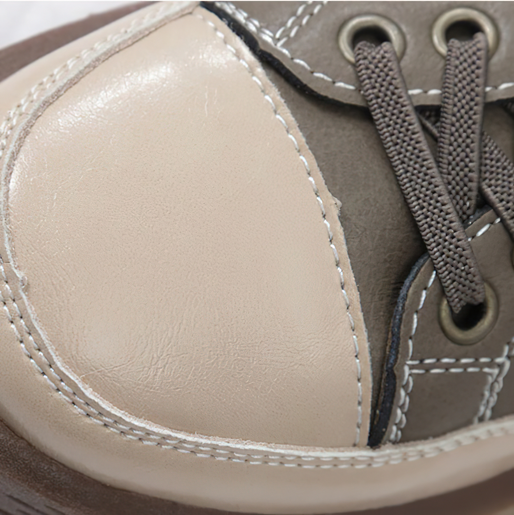 Close-up of stylish ladies genuine leather sneaker, showcasing quality materials and detailed stitching.