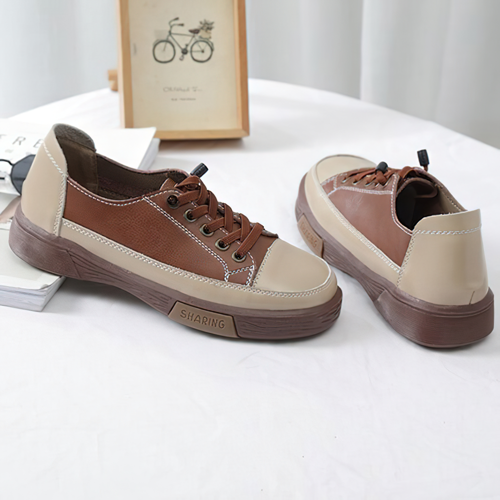 Stylish ladies genuine leather sneakers in brown and beige, perfect for casual fashion and all-day comfort.