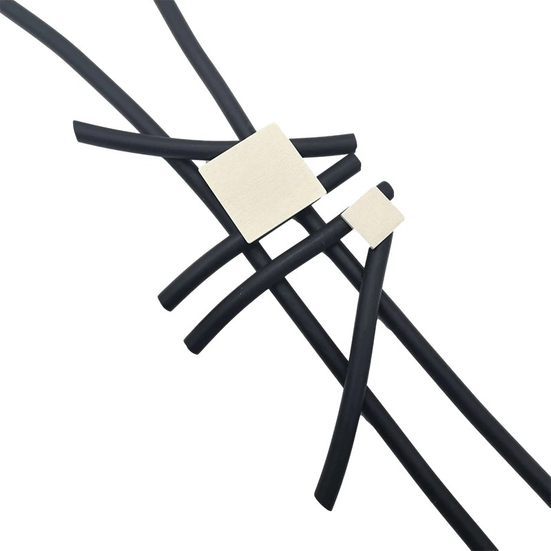 Stylish long statement necklace featuring a square wood pendant and rubber accents, perfect for casual wear.