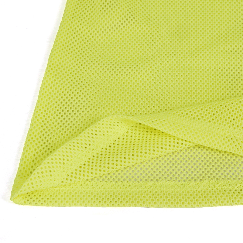 Close-up of bright yellow mesh fabric showcasing its lightweight and breathable texture for stylish tops.