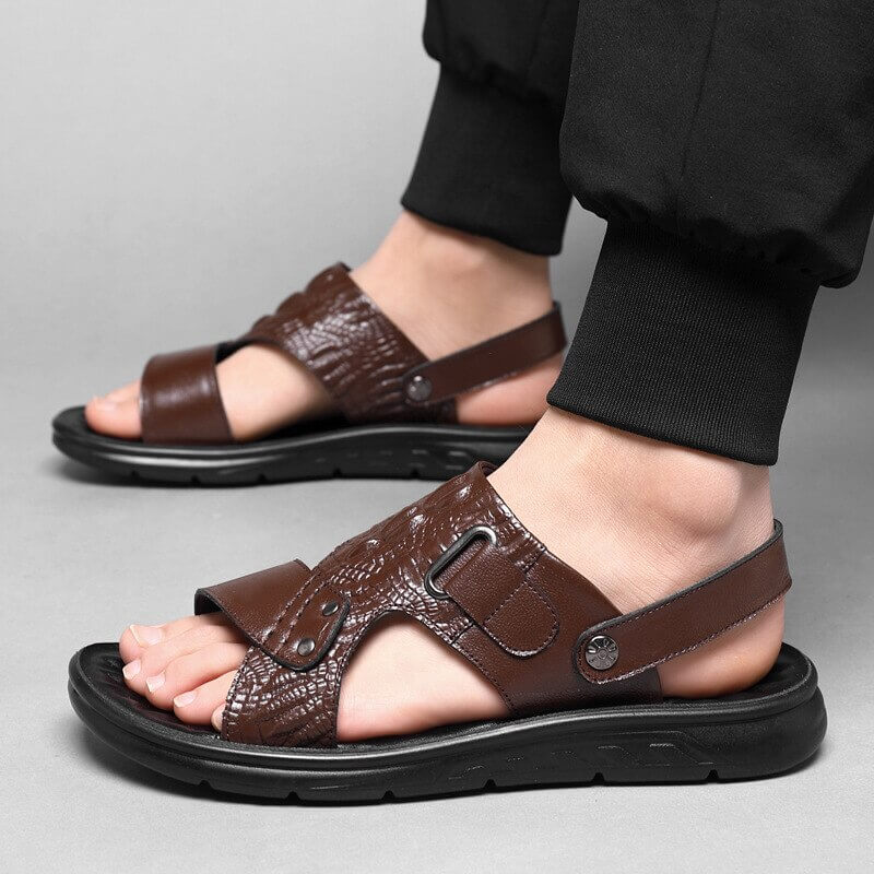 Stylish men's brown leather sandals with strap buckle, perfect for casual comfort and urban outings.