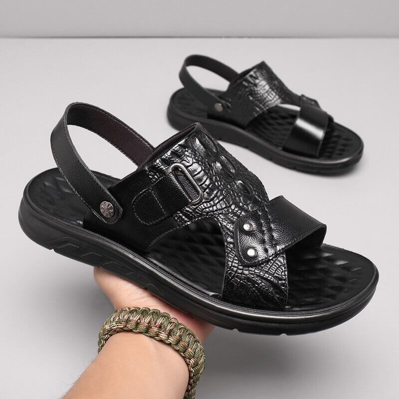 Stylish black genuine leather sandals with strap buckle, ideal for casual comfort and daily wear for men.