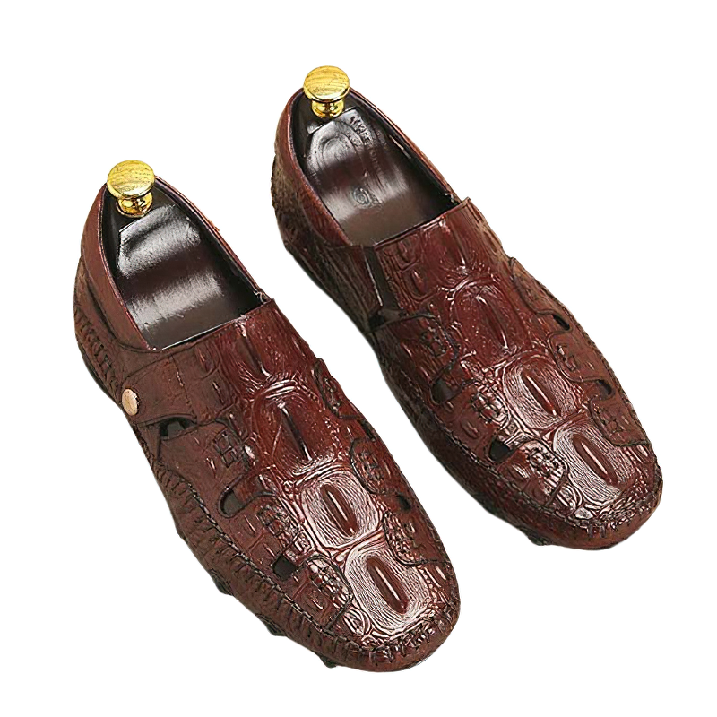 Stylish brown leather moccasins with a crocodile texture and decorative shoe trees for casual occasions.