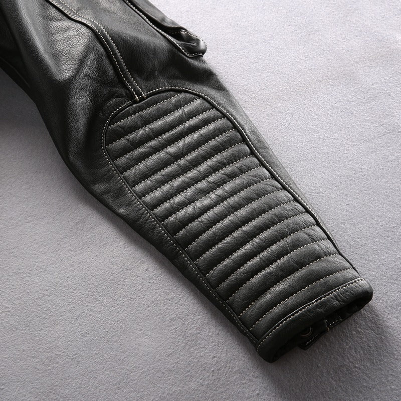Close-up of the quilted elbow section of a stylish multi-pocket genuine leather motorcycle jacket.