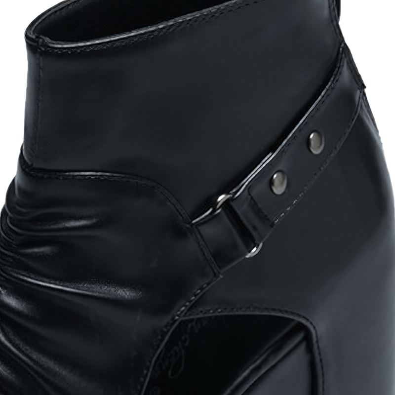 Close-up of stylish black ankle boot with buckle detail and open-toe design for women.
