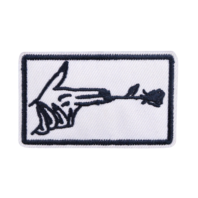 Stylish finger gun and flower embroidery patch for clothing, perfect for adding a trendy touch to your style.