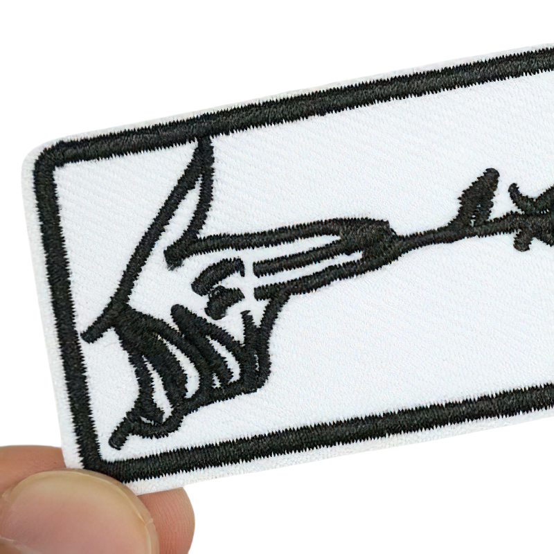 Stylish iron-on patch featuring finger gun design, perfect for adding a trendy touch to clothing.