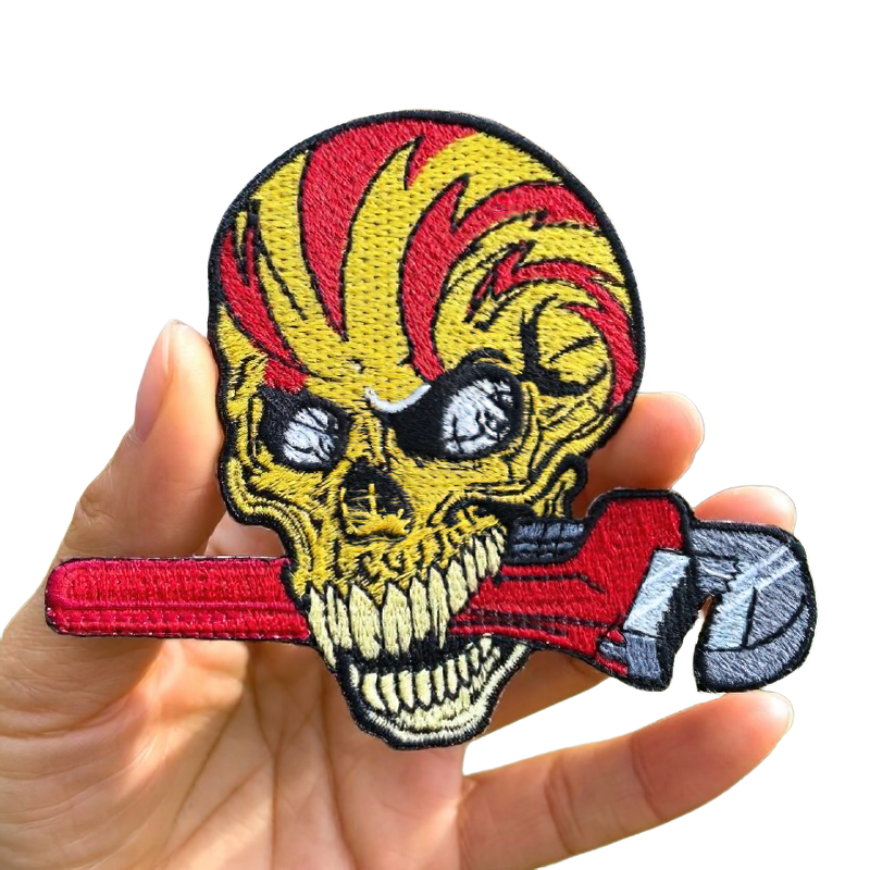 Stylish unisex skull patch with adjustable wrench in teeth, perfect rock style accessory for your wardrobe.