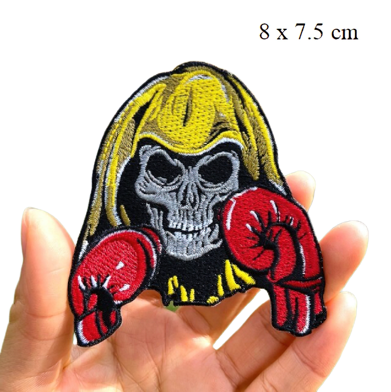 Stylish gothic patch featuring a skull with long hair and red boxing gloves, perfect for clothing accessories.