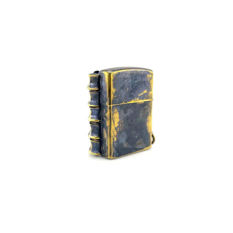 Stylish unisex brass portable lighter box in rock style with spine detail, perfect accessory for any outfit.