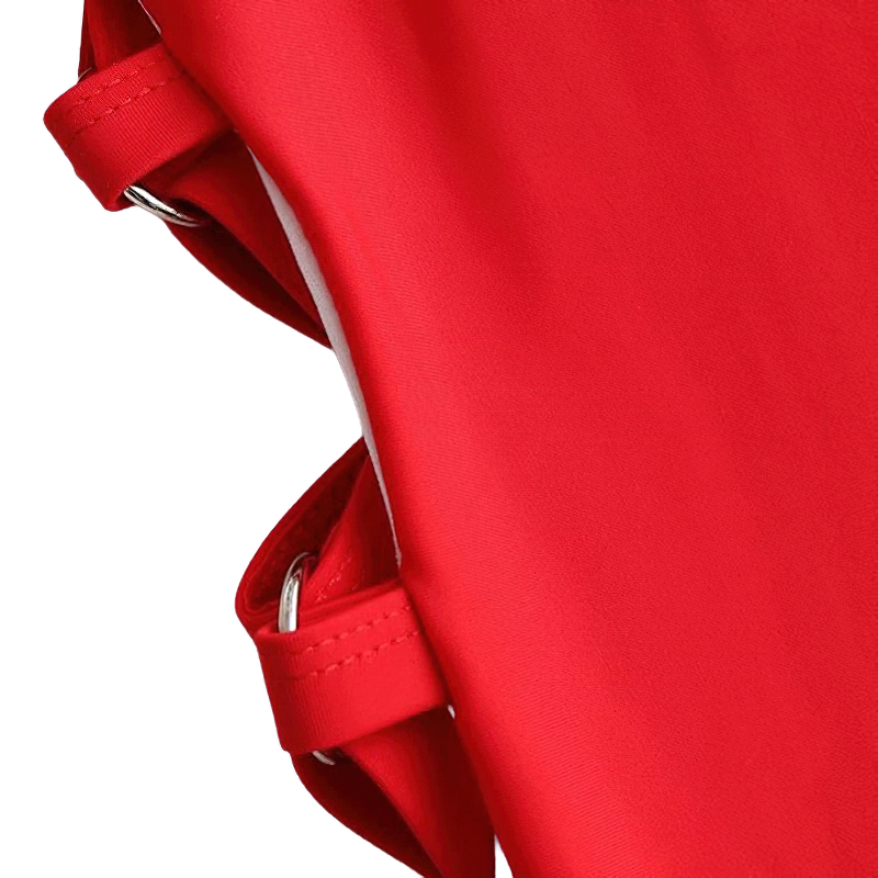 Close-up of red stylish hollow out monokini swimsuit straps for women, perfect for summer fashion.