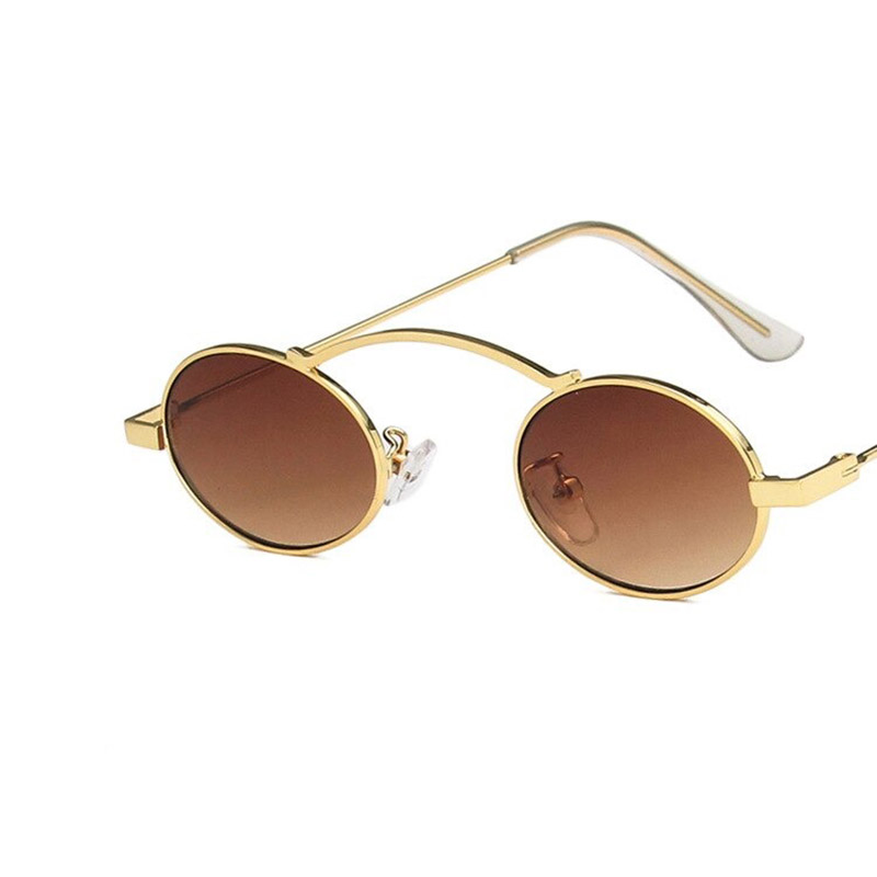 Stylish small oval sunglasses in steampunk style with gold frames and brown lenses.