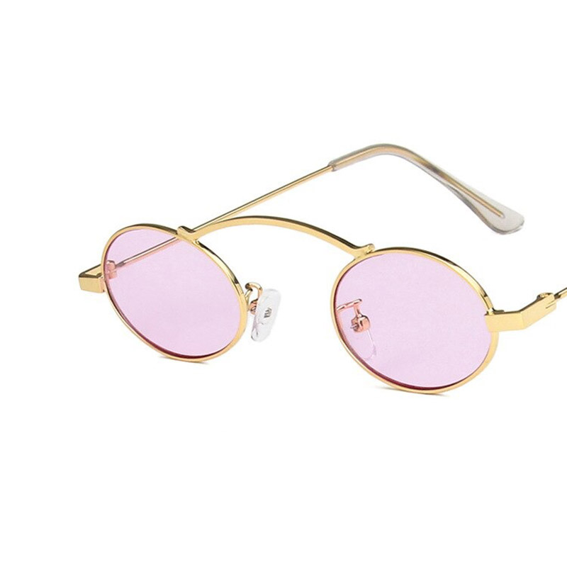 Stylish small oval sunglasses with pink lenses and gold frames, perfect for a steampunk-inspired look.