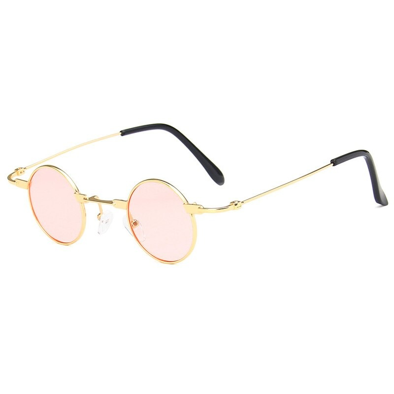 Stylish small round sunglasses for men and women in steampunk style with pink lenses and gold frames.
