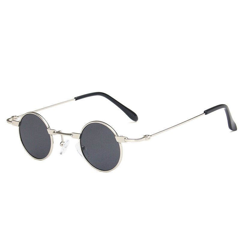 Stylish small round sunglasses in steampunk style for men and women - unisex alloy design with dark lenses.