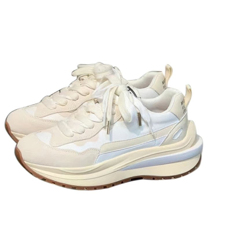 Trendy women's chunky sneakers in white with stylish laces and a comfortable sole for casual wear.