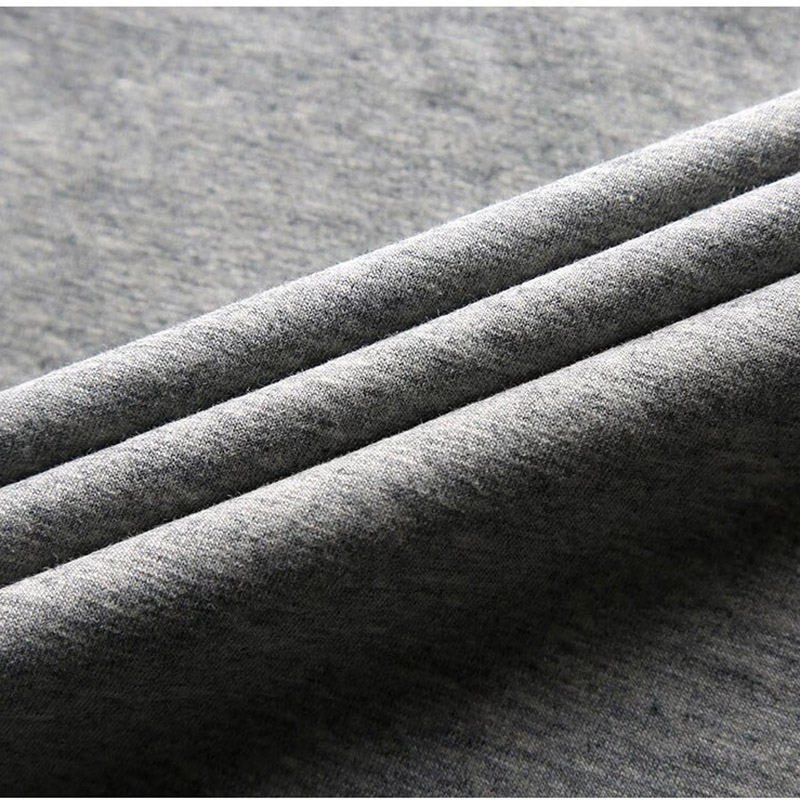 Close-up of soft gray fabric showcasing the stretch material for stylish men's V neck t-shirts.